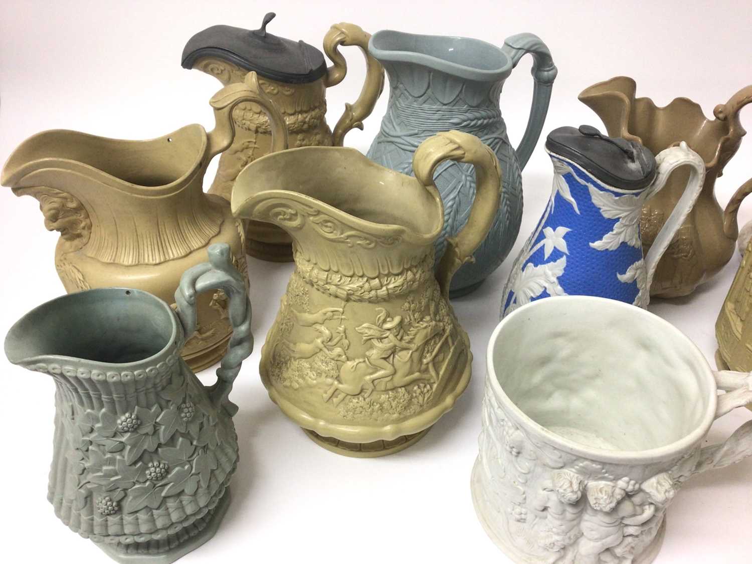 Lot 378 - A collection of 19th century pottery jugs