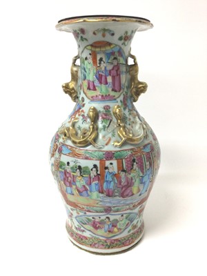 Lot 368 - 19th century Chinese Canton famille rose baluster vase, converted to a lamp, decorated with figural panels on a ground of precious objects, flowers and insects, with foo dog handles and moulded dra...