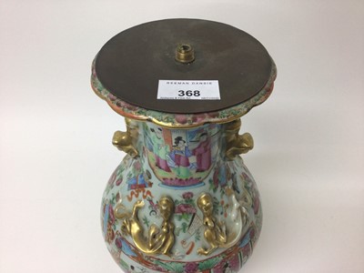 Lot 12 - 19th century Chinese Canton famille rose baluster vase, converted to a lamp, decorated with figural panels on a ground of precious objects, flowers and insects, with foo dog handles and moulded dra...