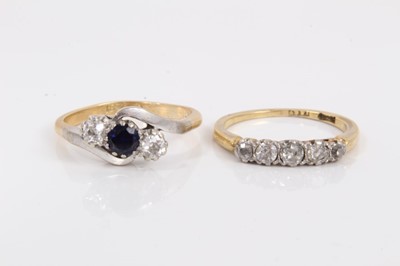 Lot 829 - 18ct gold diamond five stone ring and 18ct gold sapphire and diamond three stone cross over ring (sapphire possibly synthetic)