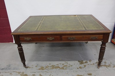 Lot 71 - Edwardian oak library table, with inset tooled leather top and two frieze drawers to each side on reeded supports and castors, 151cm wide x 106cm deep x 78cm high