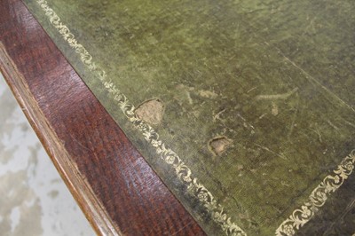 Lot 71 - Edwardian oak library table, with inset tooled leather top and two frieze drawers to each side on reeded supports and castors, 151cm wide x 106cm deep x 78cm high
