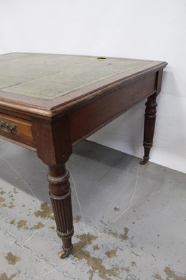 Lot 71 - Edwardian oak library table, with inset tooled leather top and two frieze drawers to each side on reeded supports and castors, 151cm wide x 106cm deep x 78cm high