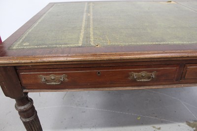 Lot 71 - Edwardian oak library table, with inset tooled leather top and two frieze drawers to each side on reeded supports and castors, 151cm wide x 106cm deep x 78cm high