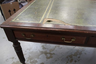 Lot 71 - Edwardian oak library table, with inset tooled leather top and two frieze drawers to each side on reeded supports and castors, 151cm wide x 106cm deep x 78cm high