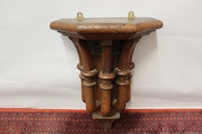 Lot 1495 - Victorian gothic oak wall bracket, pierced and carved tapered support, 45cm wide x 64cm high