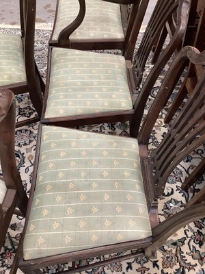 Lot 1496 - Set of six Hepplewhite style mahogany dining chairs, each with arched pierced splat back and slip in seat on square legs and stretchers, including two carvers