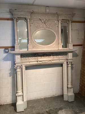 Lot 1498 - Impressive Neo-Classical revival carved and gesso fire surround, the overmantel with three mirrored plates and projecting Corinthian columns, with mask and foliate swag ornament, raised conforming...