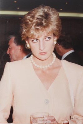 Lot 150 - Diana, Princess of Wales, five amusing informal photographs of Diana at a cocktail party