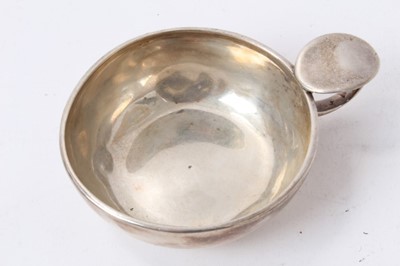 Lot 154 - A silver wine taster (marks rubbed) and two white metal wine tasters