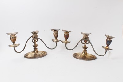 Lot 560 - Pair of silver plated candelabrum of navette form with reeded decoration, each 36.5cm in length. (2)