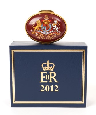 Lot 154 - H.M.Queen Elizabeth II 2012 Royal Household Christmas present, Halycon Days enamel Diamond Jubilee oval pill box decorated with the Royal Arms, 2012 and ' Presented by Her Majesty The Queen ' in or...