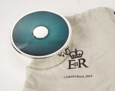 Lot 156 - H.M.Queen Elizabeth II 2014 Royal Household Christmas present, silver plated and green enamel circular trinket box with crowned ERII cipher to centre, velvet lined interior, 7.6cm diameter in cotto...