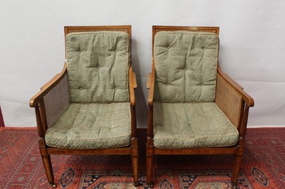 Lot 1518 - Fine pair of 19th century mahogany and satinwood crossbanded bergère chairs, raised on square tapered legs and castors, stencil number to frame