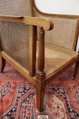 Lot 1518 - Fine pair of 19th century mahogany and satinwood crossbanded bergère chairs, raised on square tapered legs and castors, stencil number to frame