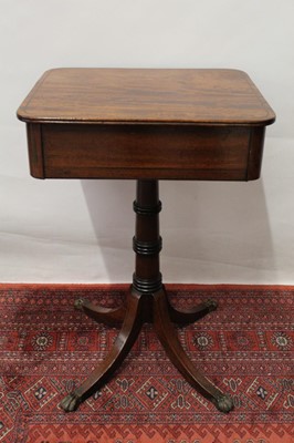 Lot 1519 - Regency mahogany single drawer occasional table, with brass inlaid rounded rectangular top and frieze drawer on ring turned column and splayed quadruped supports on lion paw feet, 40 x 48cm