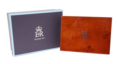 Lot 158 - H.M.Queen Elizabeth II 2017 Royal Household Christmas present, burr elm valet box 15 cm wide with silvered crowned ERII cipher to lid, lined interior, original cloth cover and box both with Royal c...