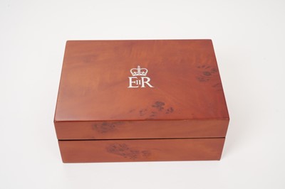 Lot 158 - H.M.Queen Elizabeth II 2017 Royal Household Christmas present, burr elm valet box 15 cm wide with silvered crowned ERII cipher to lid, lined interior, original cloth cover and box both with Royal c...