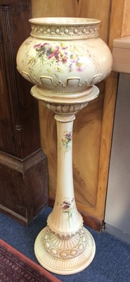 Lot 369 - An imposing Royal Worcester blush ivory jardiniere and stand, hand painted with thistles and other flowers, model number 1925
