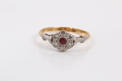Lot 40 - Ruby and diamond cluster ring with a daisy head cluster with central ruby and single cut diamonds in platinum setting on 18ct yellow gold shank.