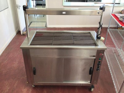 Lot 54 - A Moffat 2V1 electric hot cabinet, with twin sliding doors, heated glass plate top and gantry above, on castors, cable and plug, 1190 mm