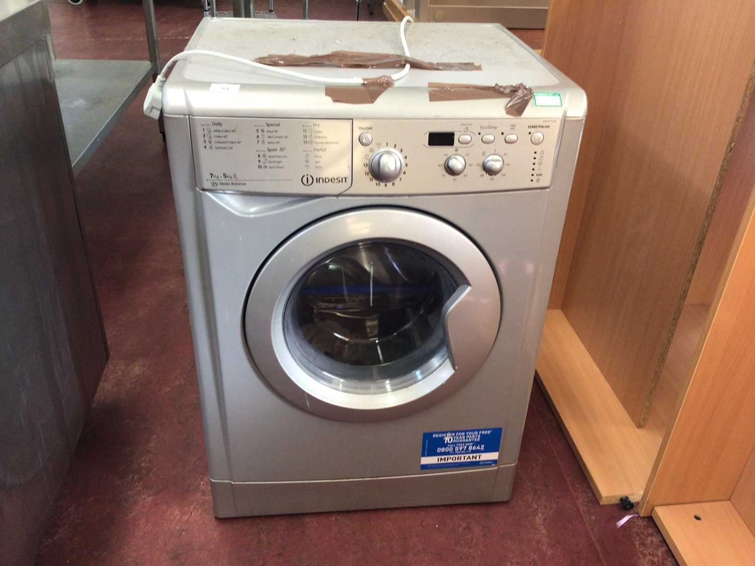 Lot 53 - An Indesit WDD71535 washing machine, together with a Zanussi ZDC 46130W dryer, cables and plugs