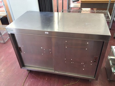 Lot 56 - A stainless steel freestanding cabinet, with two sliding doors, on castors, 1200 mm