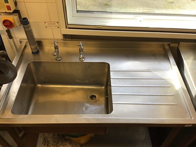 Lot 63 - A Moffat stainless steel single bowl sink unit, with two taps and shelf under, 1200 mm