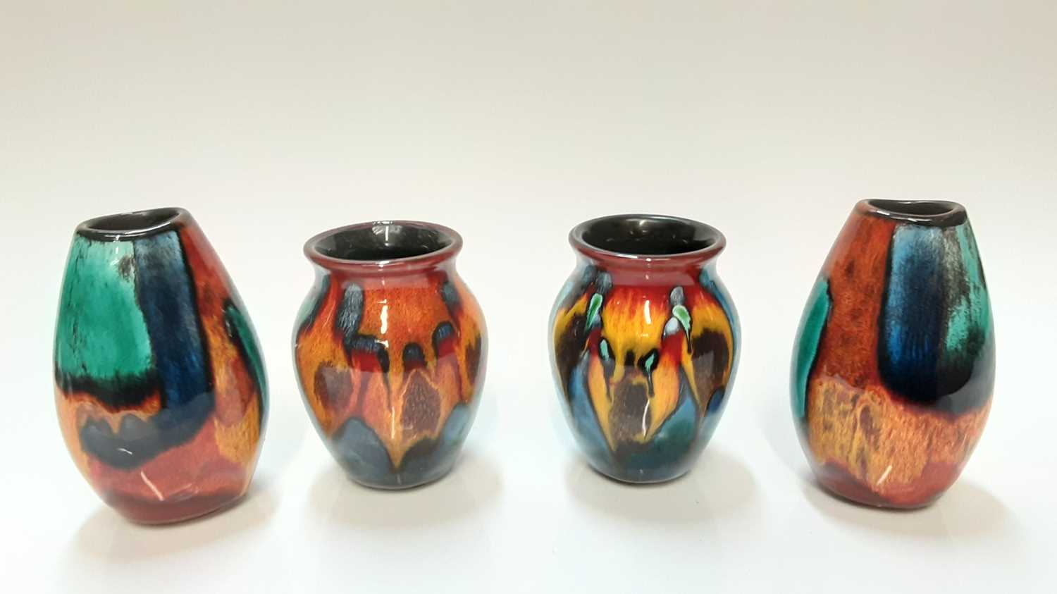 Lot 1214 - Eight various small Poole pottery vases with various abstract patterns