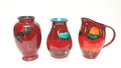 Lot 1218 - Poole pottery Odyssey vase, 23cm high, together with another vase, 21.5cm high and a Volcano handled vase, 23cm high (3)