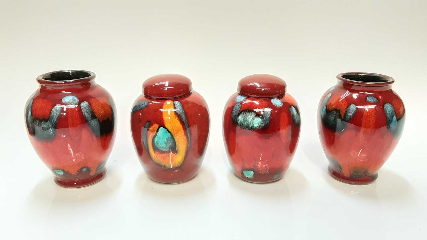 Lot 1219 Eight various small Poole pottery vases and