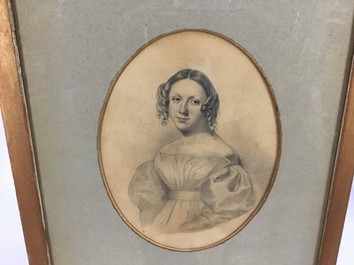 Lot 45 - Manner of Sir George Richmond pencil on paper - Portrait of a young lady of the 1820's, in oval mount, in glazed gilt frame