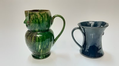 Lot 1283 - Farnham pottery green owl jug by Harris 17 cm and another blue owl jug 11cm (2)