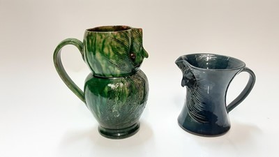 Lot 1283 - Farnham pottery green owl jug by Harris 17 cm and another blue owl jug 11cm (2)