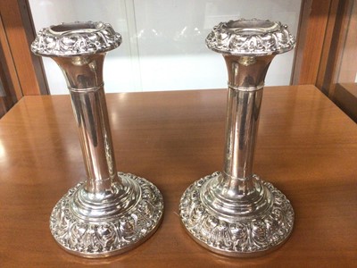 Lot 811 - Pair of Edwardian silver candlesticks