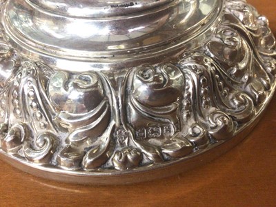 Lot 811 - Pair of Edwardian silver candlesticks