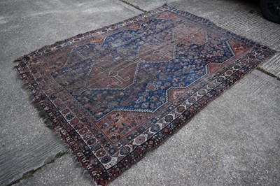 Lot 1328 - Shiraz rug with midnight blue ground and three conjoined medallions