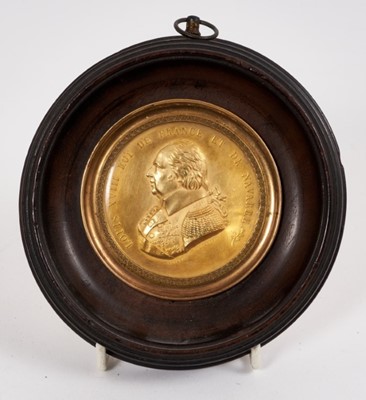 Lot 731 - 19th century gilt copper medallion depicting Louis XVIII, in ebonised 
wood frame