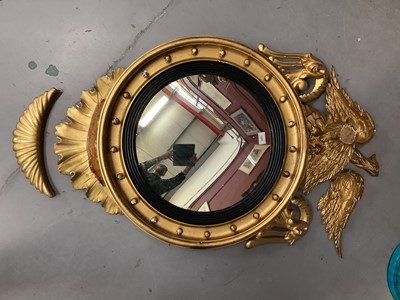 Lot 1323 - Regency gilt convex wall mirror with eagle cresting