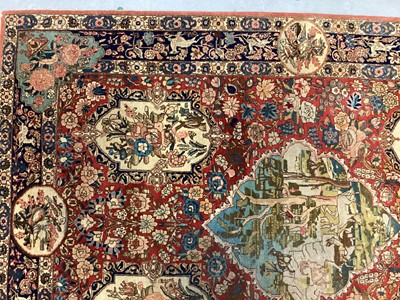 Lot 1548 - Fine quality Tabriz pictoral rug, with foliate and landscape reserves and meandering foliage on brick red grounds conforming borders