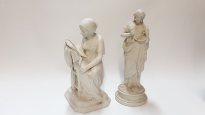 Lot 45 - Parian figure of a seated lady reading a book, 32cm high, together of a lady with painting pallette, 34.5cm high