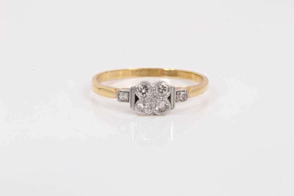 Lot 96 - Edwardian diamond cluster ring with a quatrefoil cluster of old cut diamonds in platinum setting on 18ct yellow gold shank