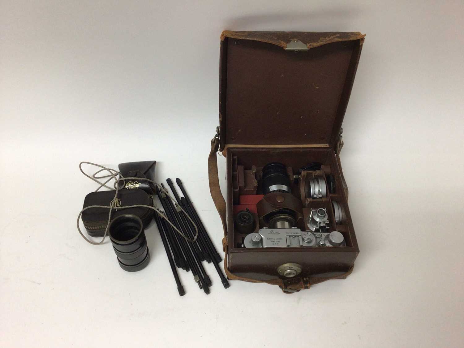 Lot 2355 - Leica III outfit dating from 1935, including body and three lenses (50mm Elmar, 35mm Elmar, 90mm Elmar), close-up lenses, cartridge spool, universal finder, and close up tube set, in original fitte...