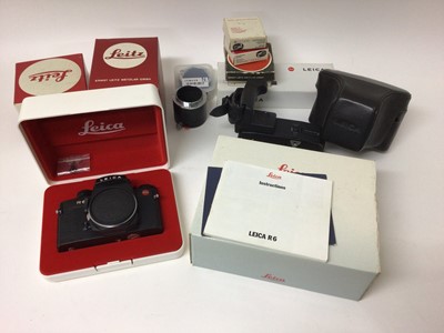 Lot 2357 - Leica R6 camera body in box, with original instructions, passport, carrying strap, motor drive, leather case, Summicron-R 50mm f/2 lens in box, Elmarit-R 28mm f/2.8 lens in box, two close up lenses...