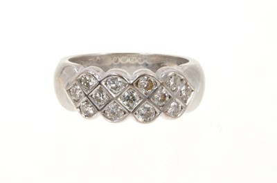 Lot 500 - Diamond ring with a triple row of thirteen brilliant cut diamonds in 18ct white gold setting.