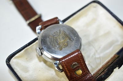 Lot 815 - Unusual Chromium plated wristwatch with engraved Nazi Swastika to cover, the underside engraved with a depiction of a V2 Rocket and the Nazi Eagle. N.B. the engraving possibly later.