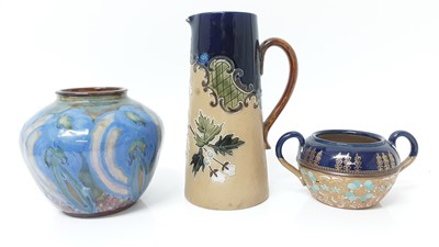 Lot 27 - An unusual Doulton Lambeth vase decorated with flowers, and two further pieces of Doulton Lambeth pottery (3)