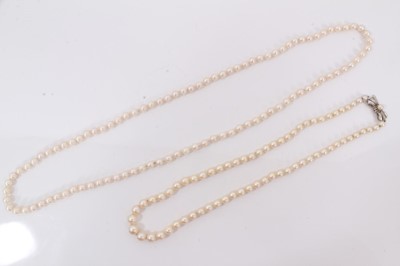Lot 287 - Cultured pearl necklace with 18ct white gold bow shaped clasp, together with one other cultured pearl necklace
