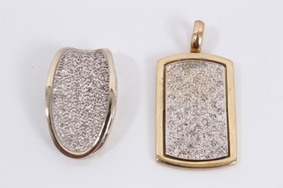 Lot 73 - Two diamond set pendants in yellow metal mounts