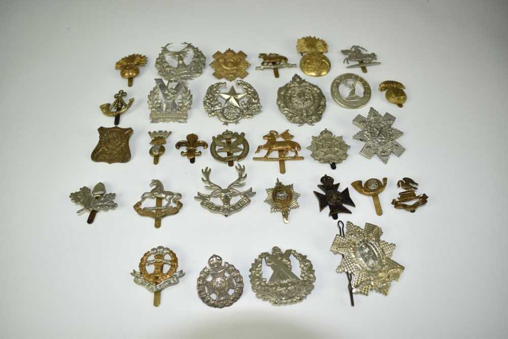 Lot 721 - Collection of twelve Scottish military cap badges to include Argyll and Sutherland Highlanders, Cameron Highlanders and others together with other military cap badges (30 badges)